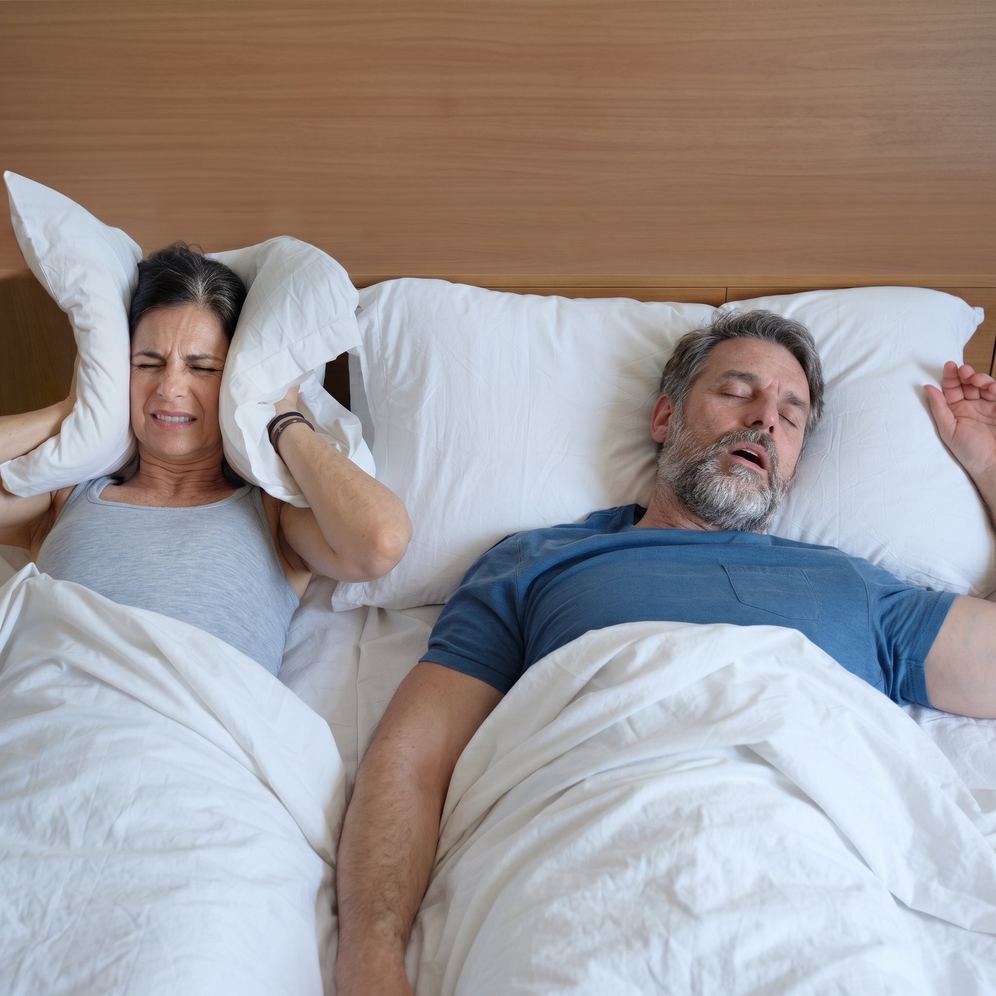 One partner awake while the other snores