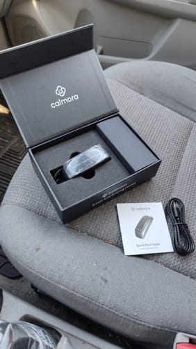 Customer photo of the device package opened on a car seat