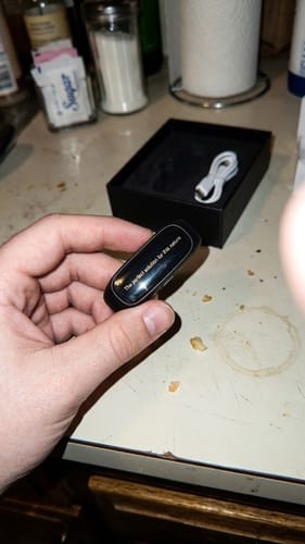 Customer holding the compact anti-snoring device